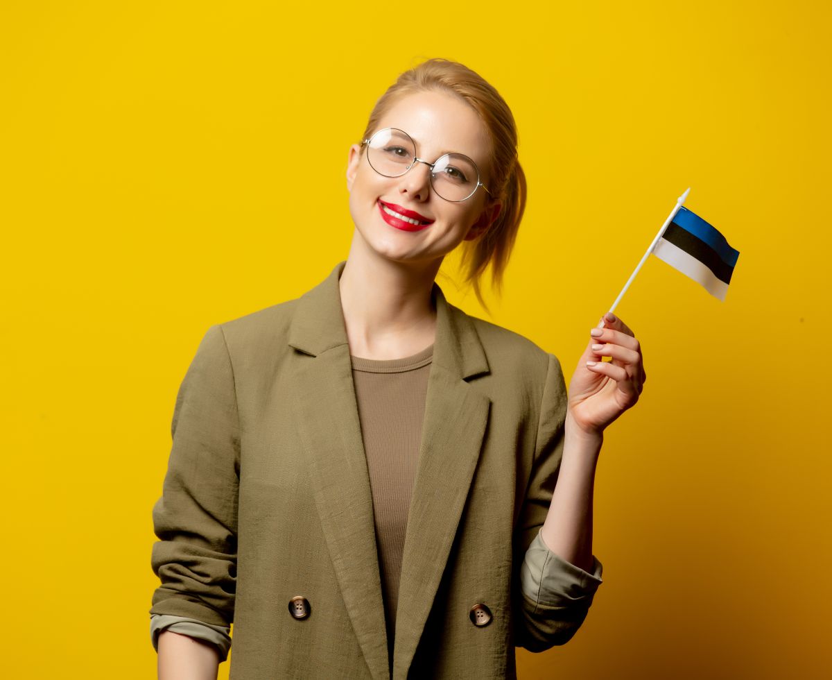 Blonde Estonian woman with country flag
