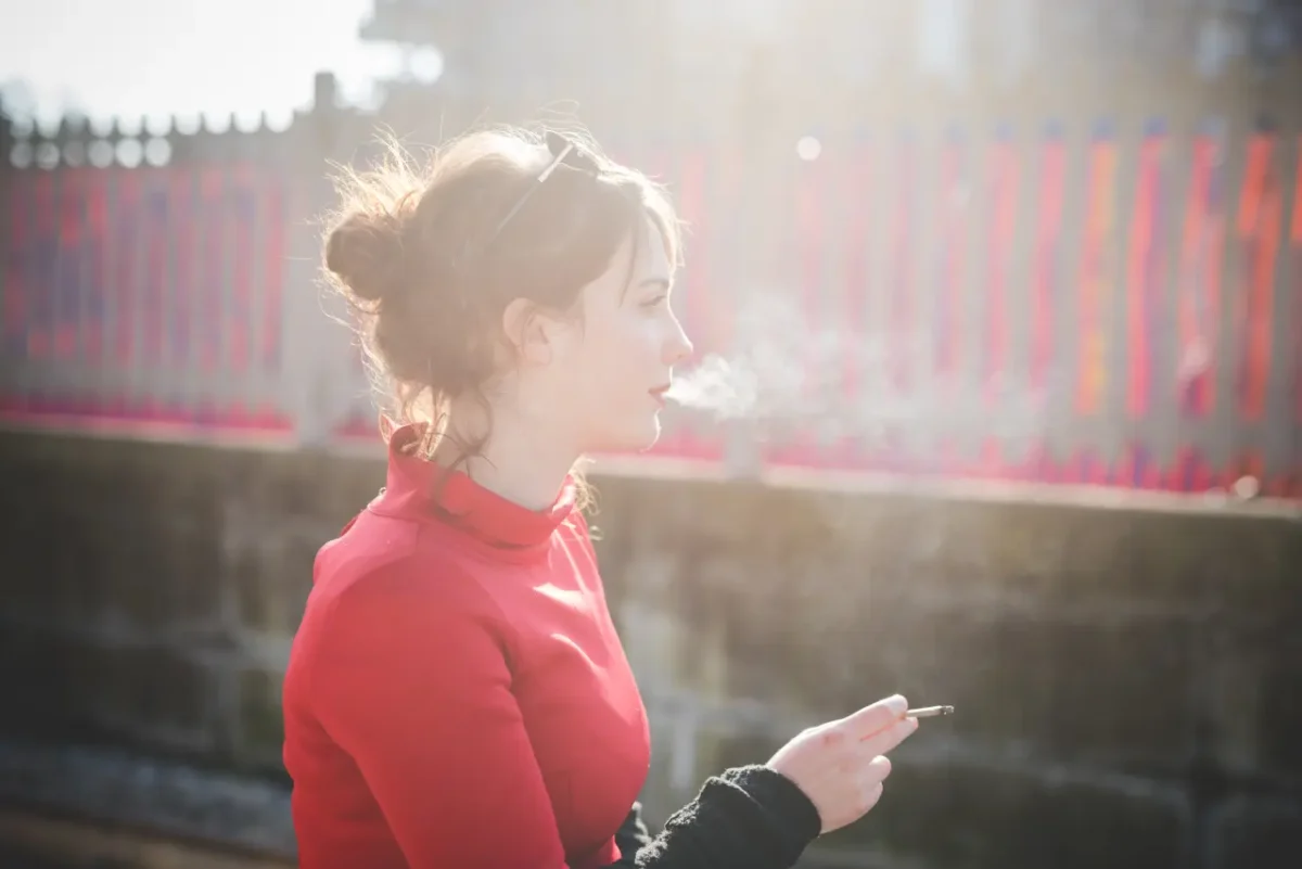 young Georgian woman smoking outdoors