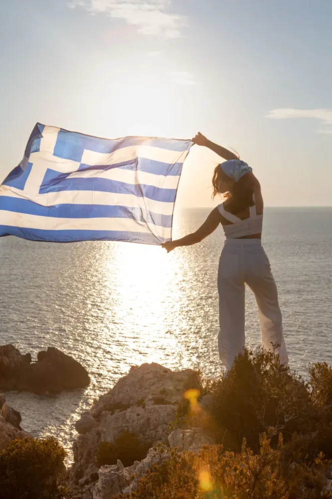 woman waving Greece flag