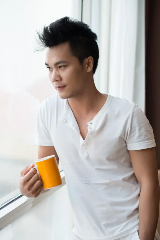 Thai man drinking coffee