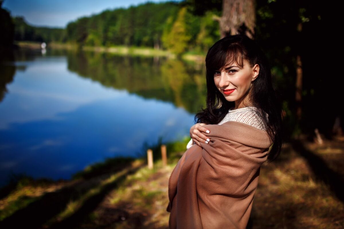 beautiful brunette by the lake
