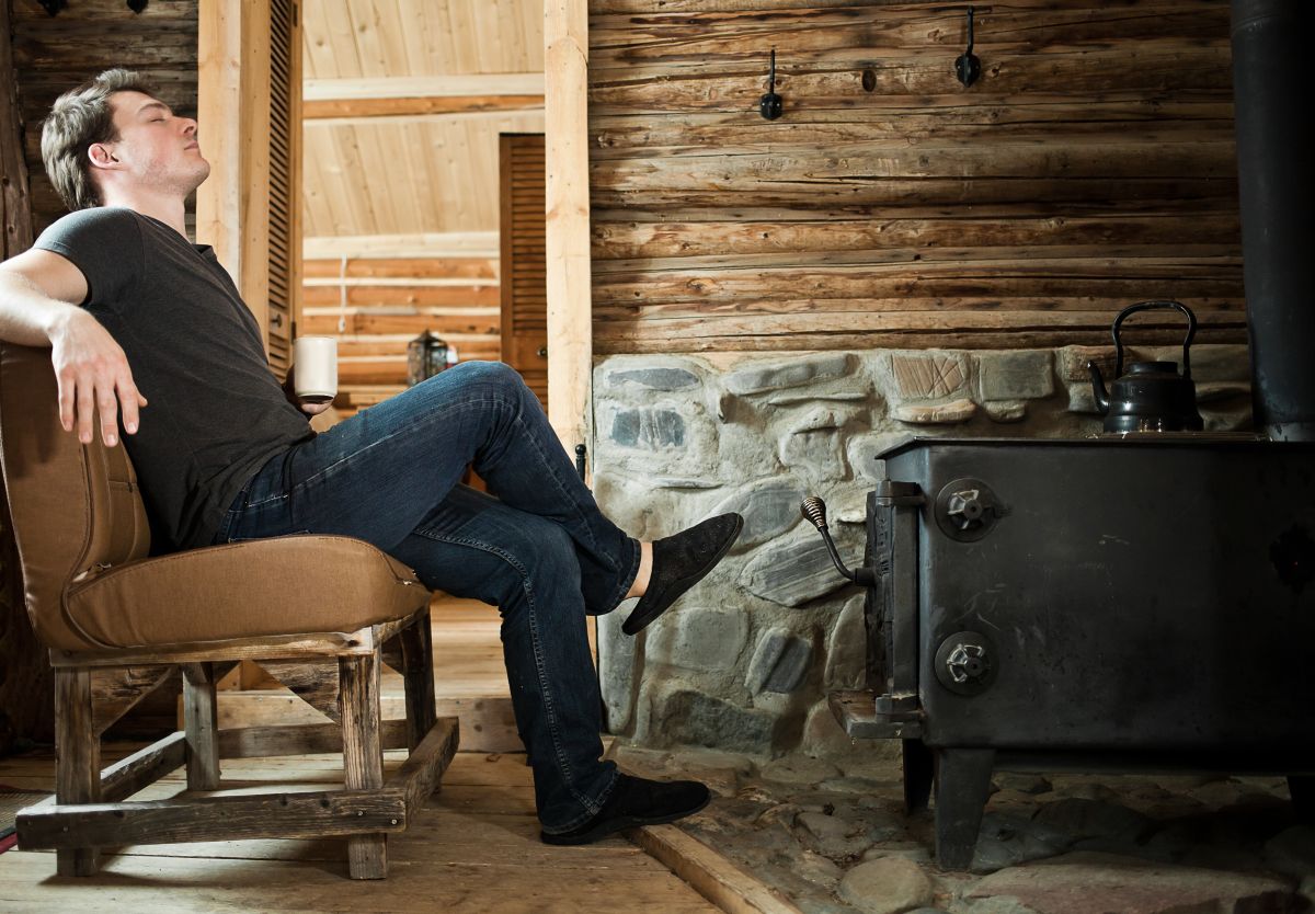 Man relaxing in cabin in Canada