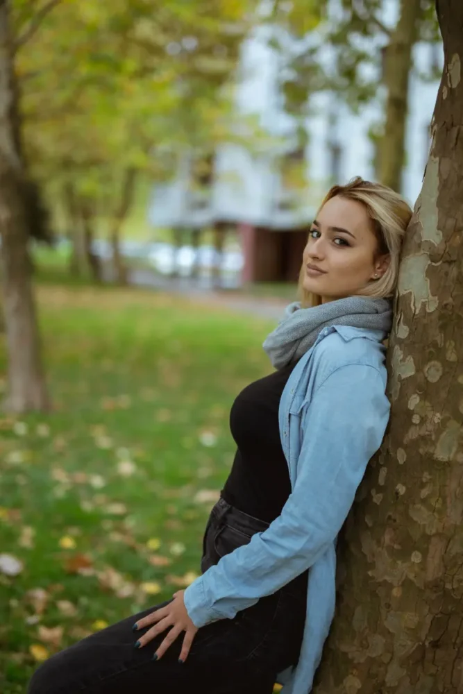 Estonian woman by a tree