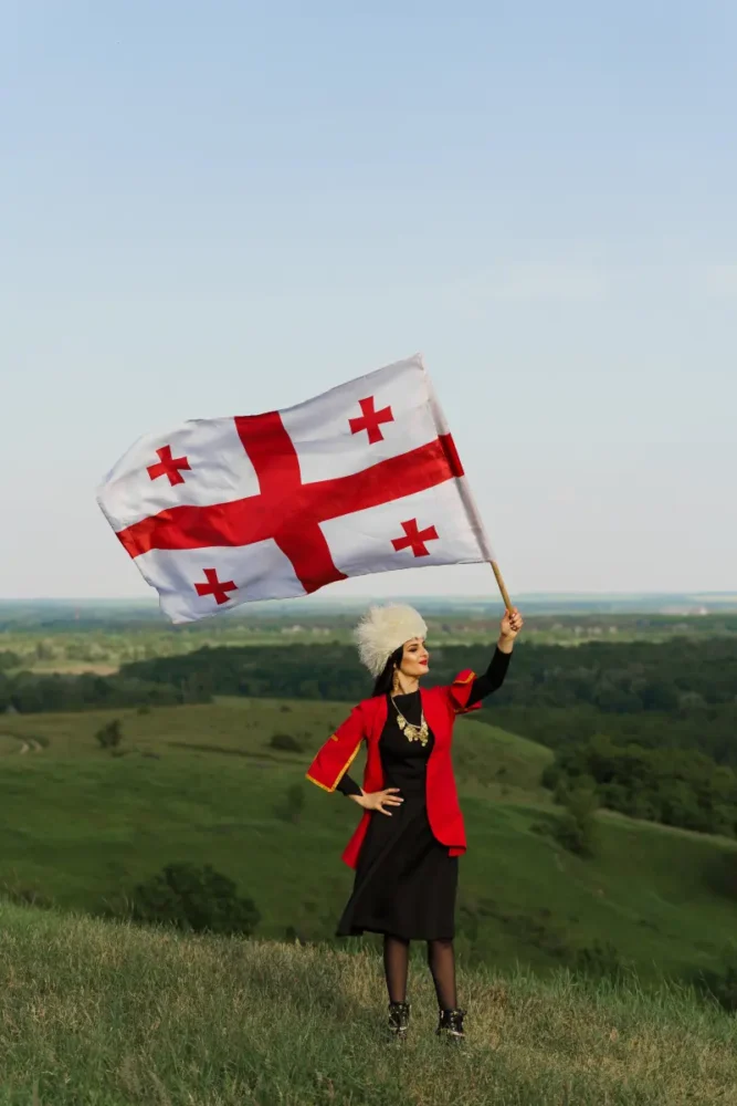 Georgian woman holding country flag