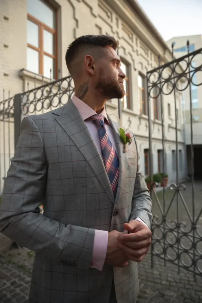tattooed Serbian man wearing a suit