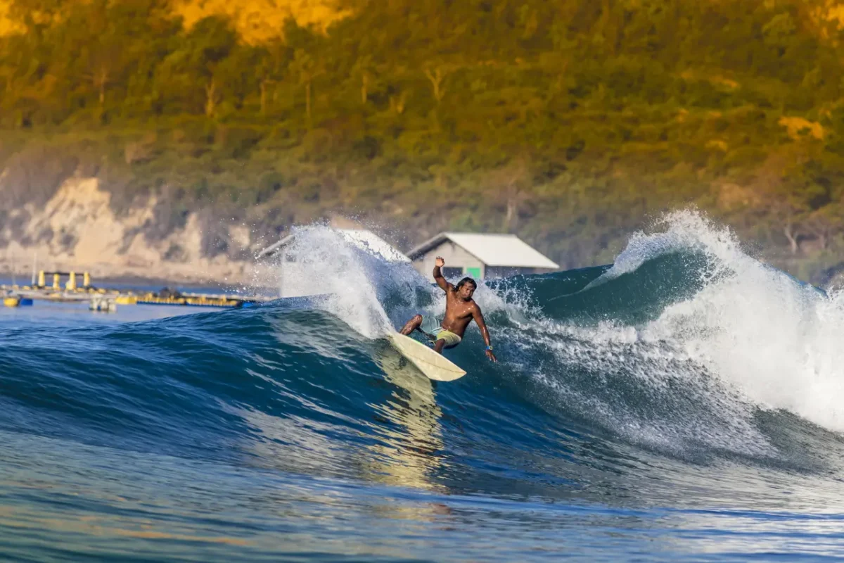 Indonesian man surfing