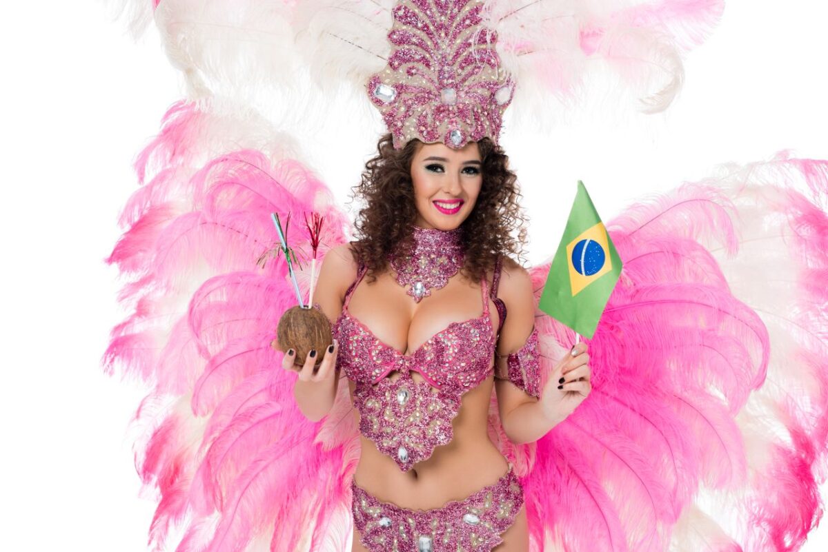 Brazilian woman in carnival costume with Brazil flag