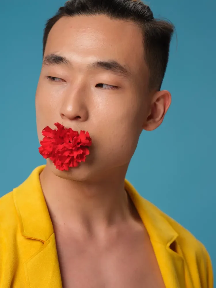 Korean Man with a Red Flower in His Mouth