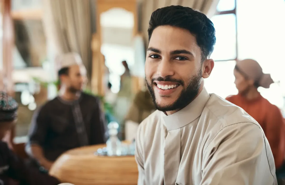 gorgeous Moroccan man smiling in a local restaurant