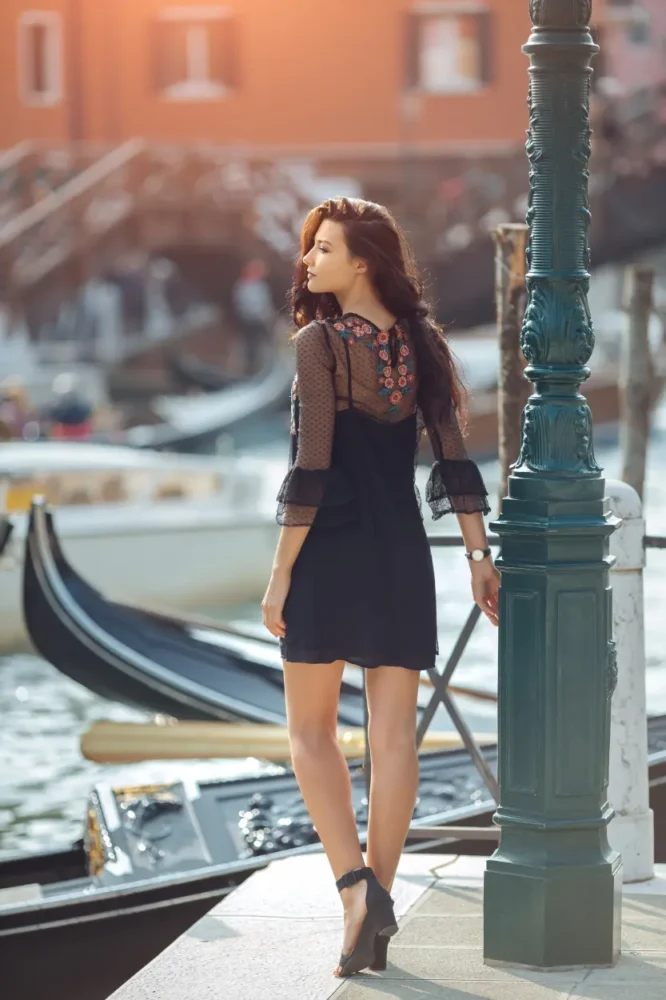 beautiful Italian woman looking at the sea