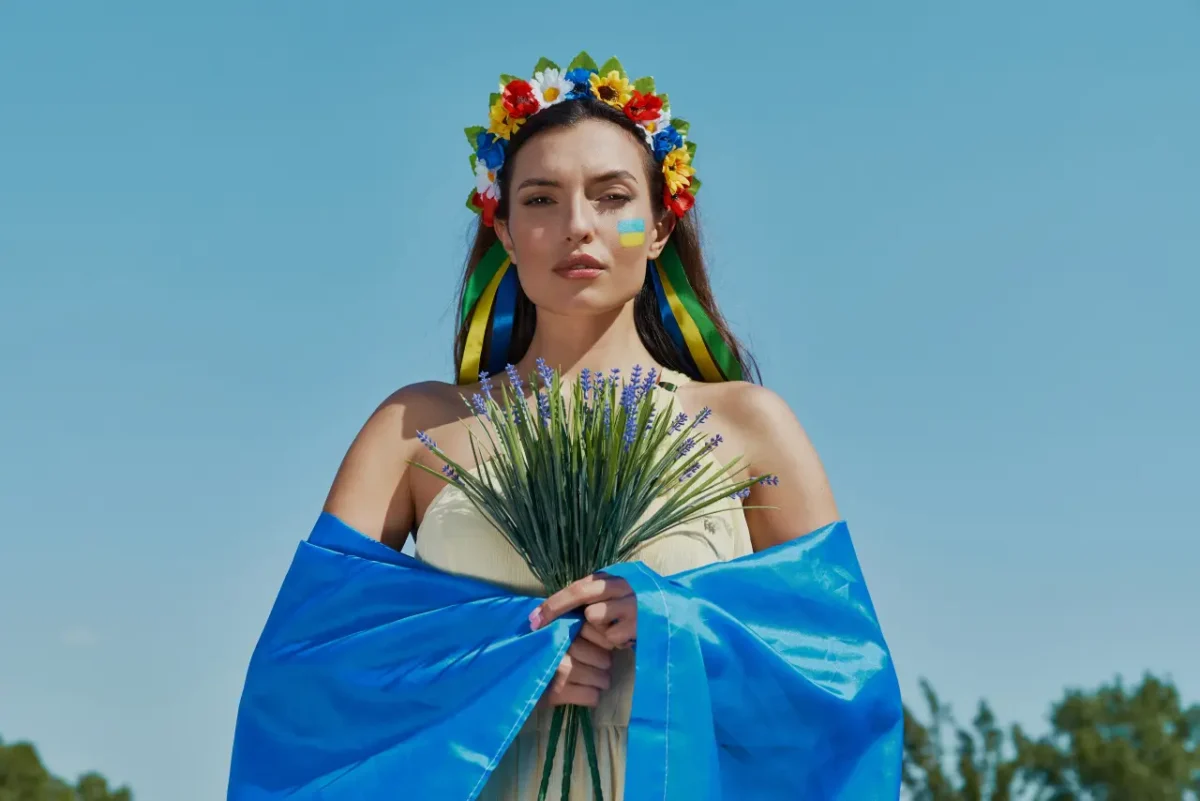 good looking Ukrainian woman wearing country's flag